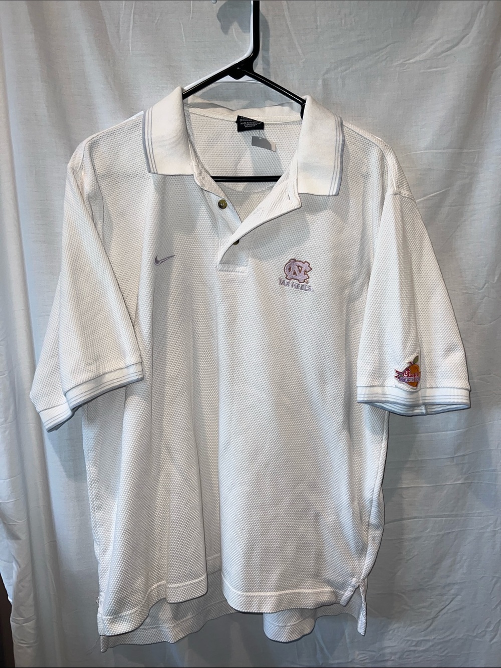 Men’s medium white waffle textured white polo. Tar Heels-Chick Fil A Peach Bowl